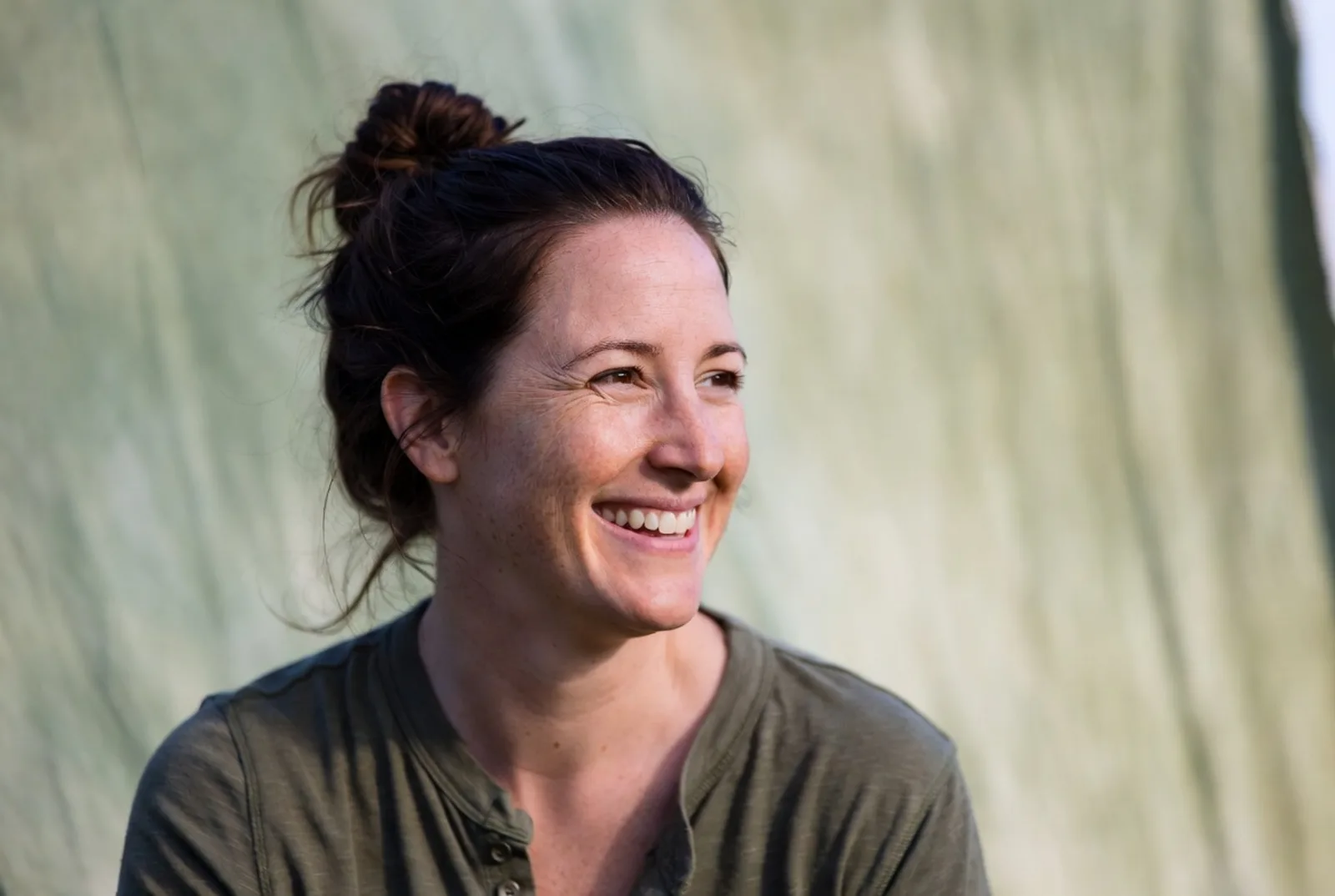 A mom in her kitchen with her kids — real life, mid-routine